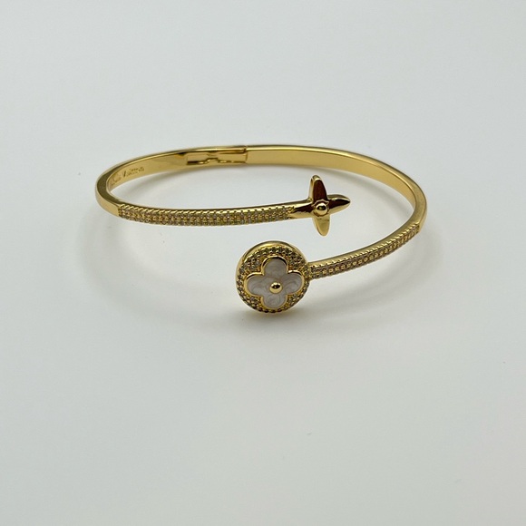 Louis Vuitton Jewelry - LV bangle open face Elegant Gold Bracelet with Floral Accent
